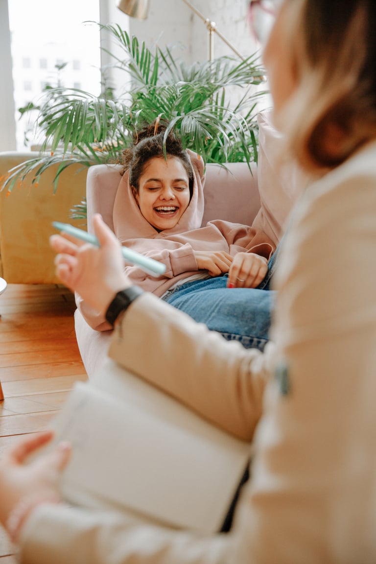 Woman Laughing on Couch